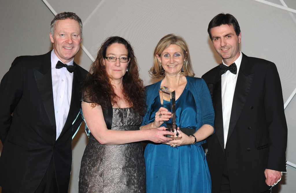 Cate Searle and Fiona Martin receive their award from Rory Bremner