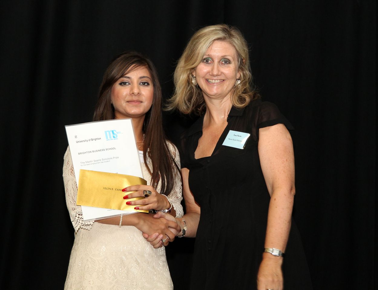 Selina Tamrat received the award for Best Employment Law Student from Fiona Martin